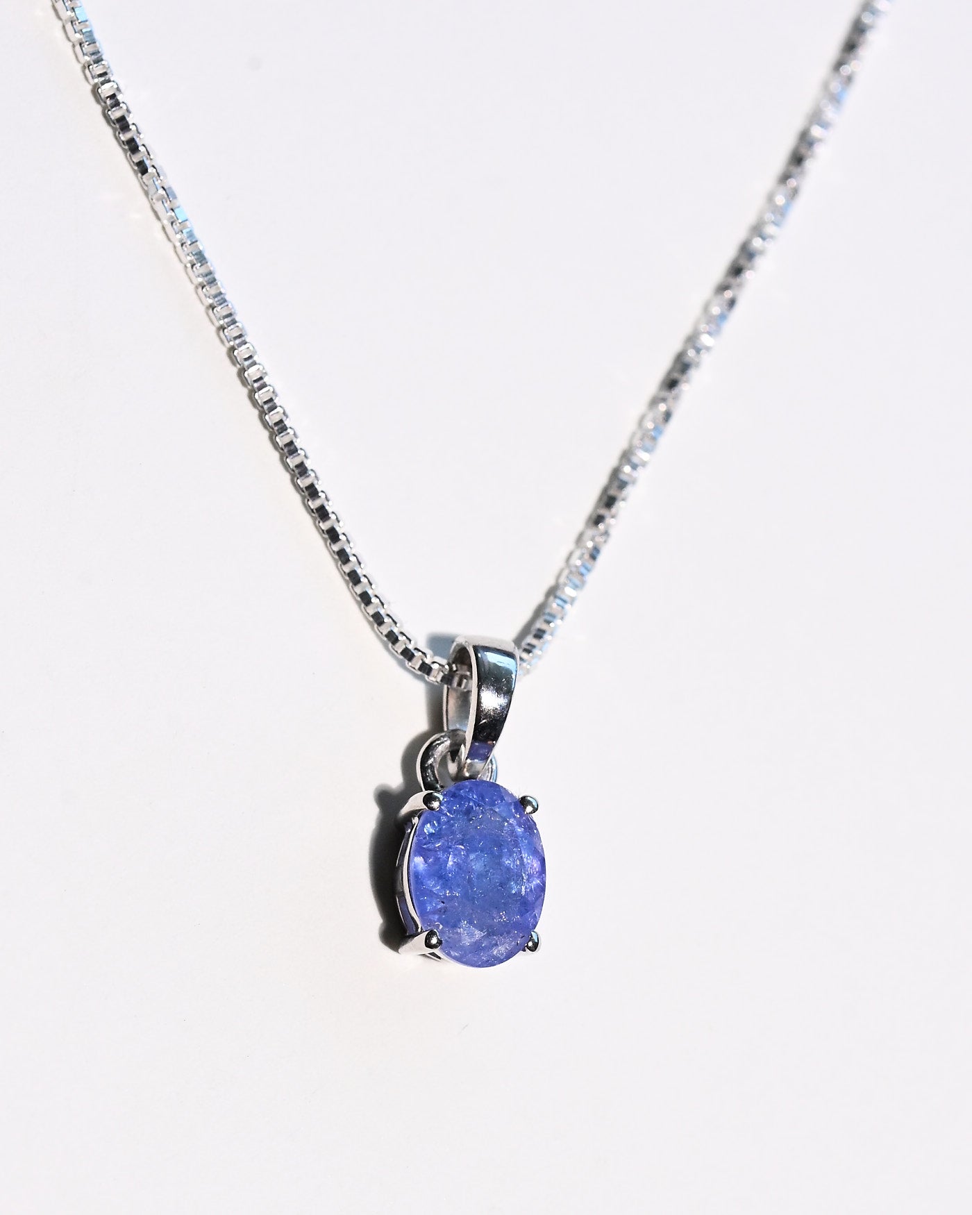 Tanzanite oval pendant detail 925 sterling silver prong setting