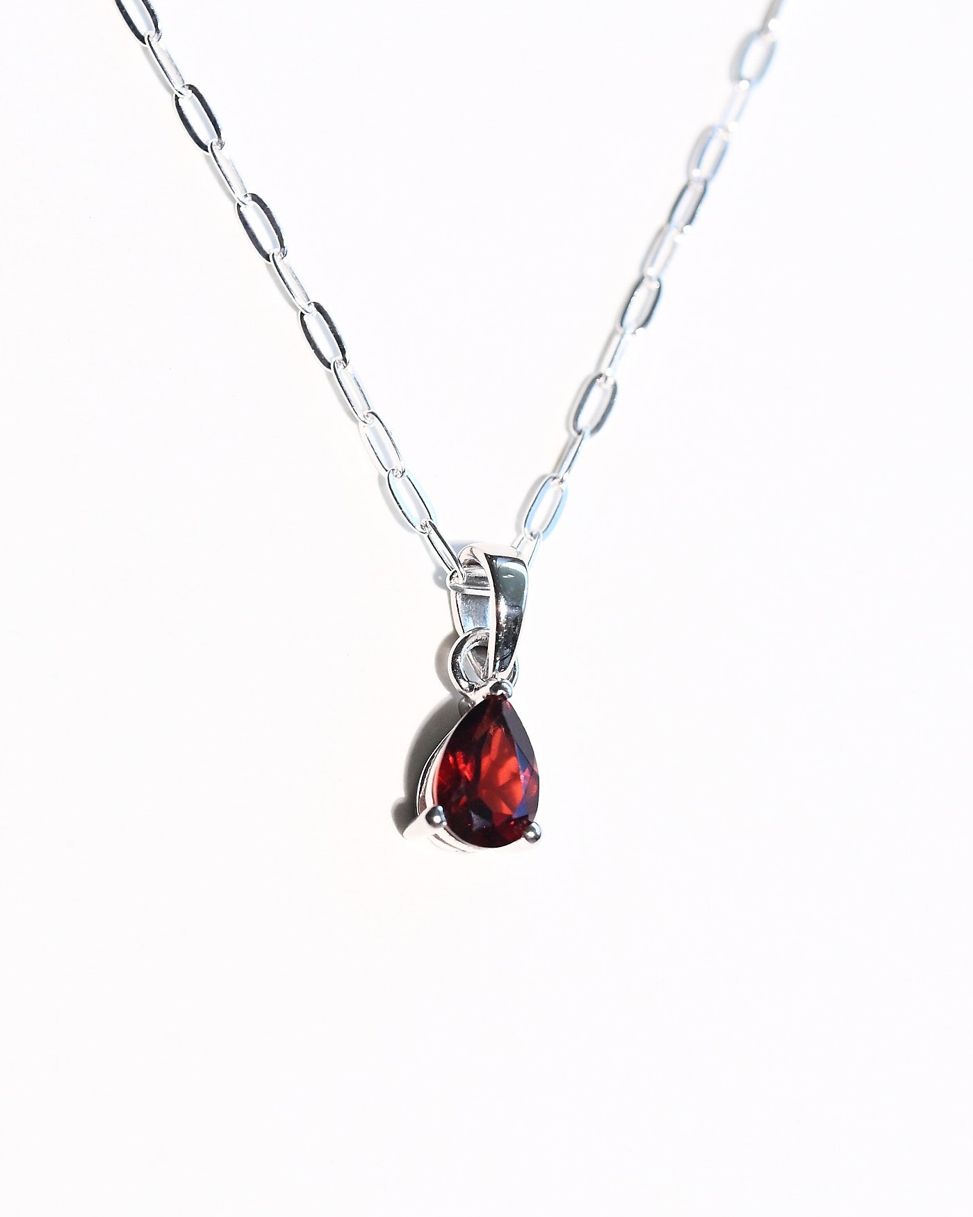 Deep red garnet pendant necklace close-up