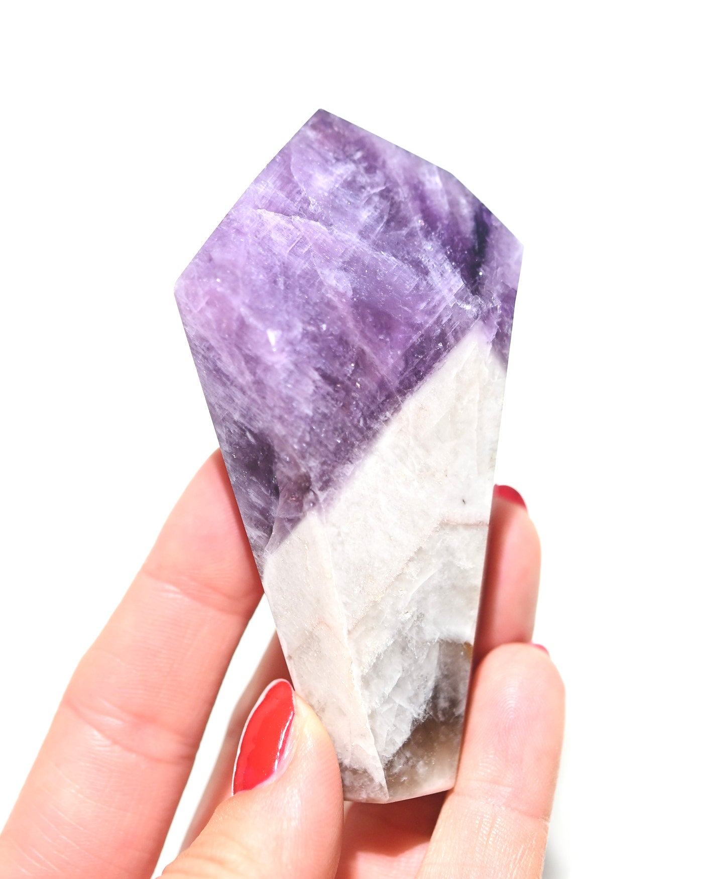 Polished trapiche amethyst crystal point from Brazil, front view