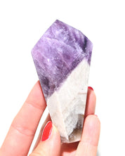 Polished trapiche amethyst crystal point from Brazil, front view