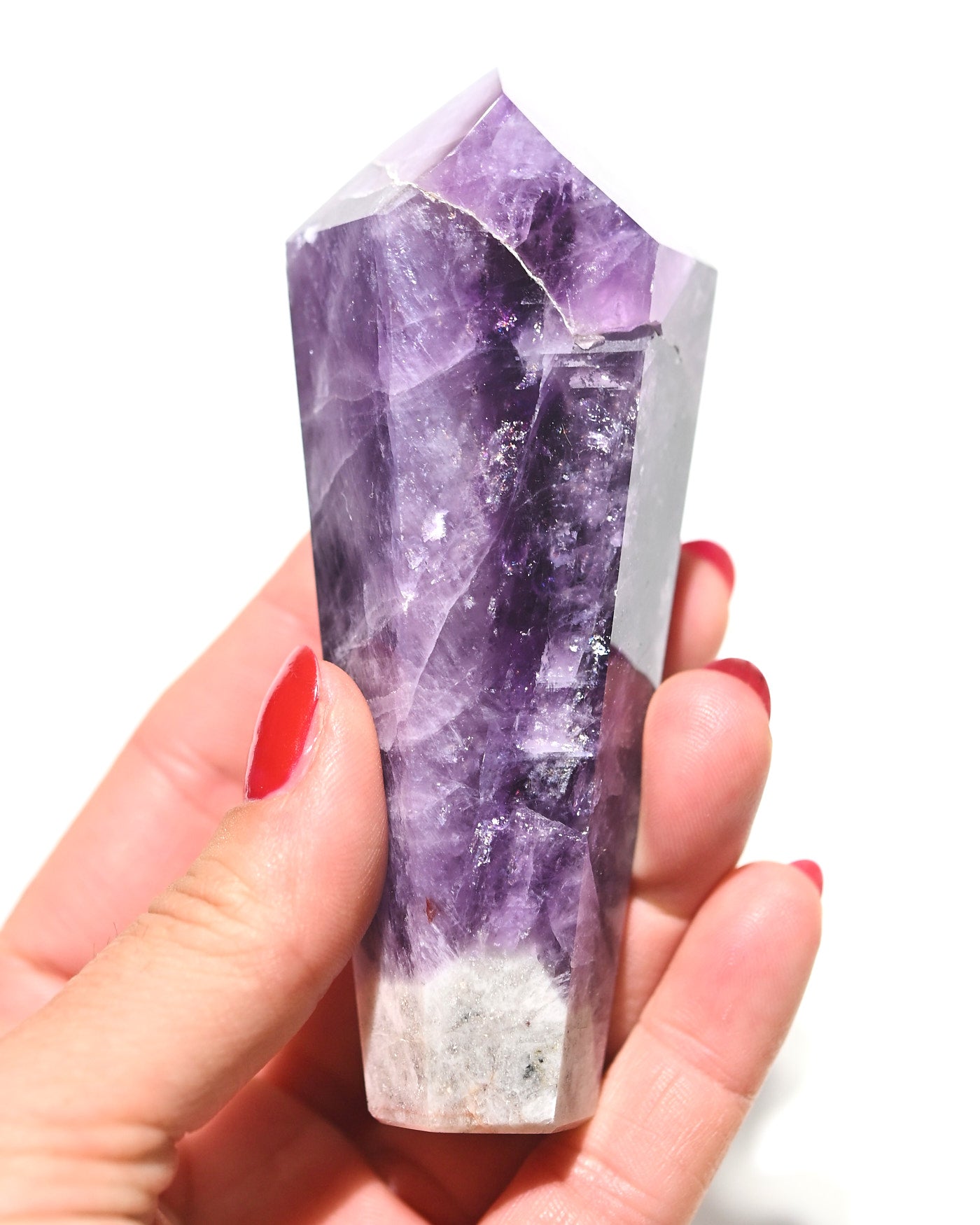 Trapiche Amethyst Point - polished crystal point close up detail
