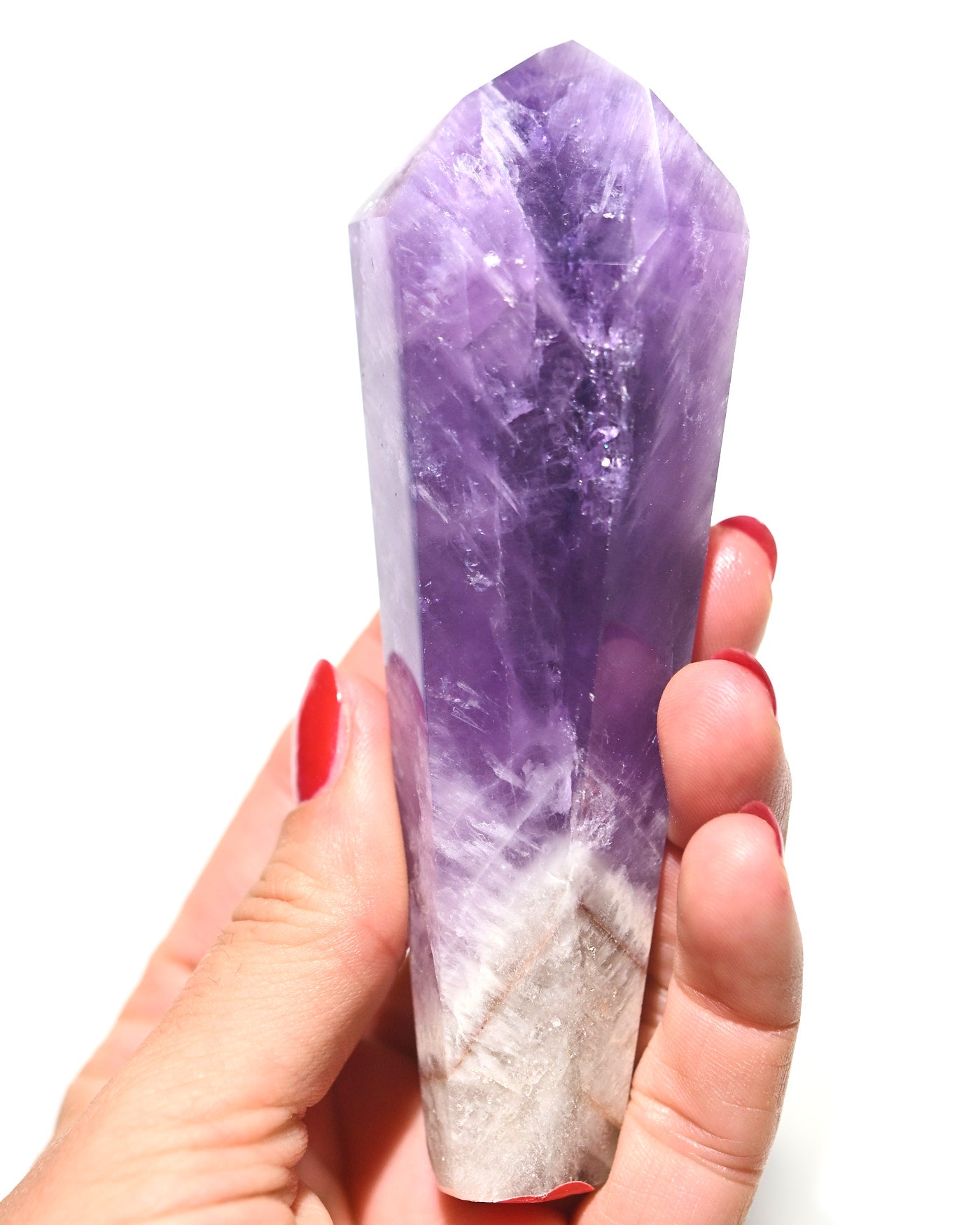 Trapiche Amethyst Point - hand-held view showing deep purple saturation and white quartz base