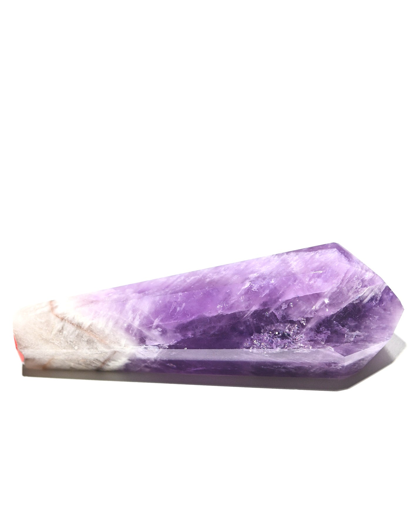 Trapiche Amethyst Point - side view showing natural chevron pattern and translucency