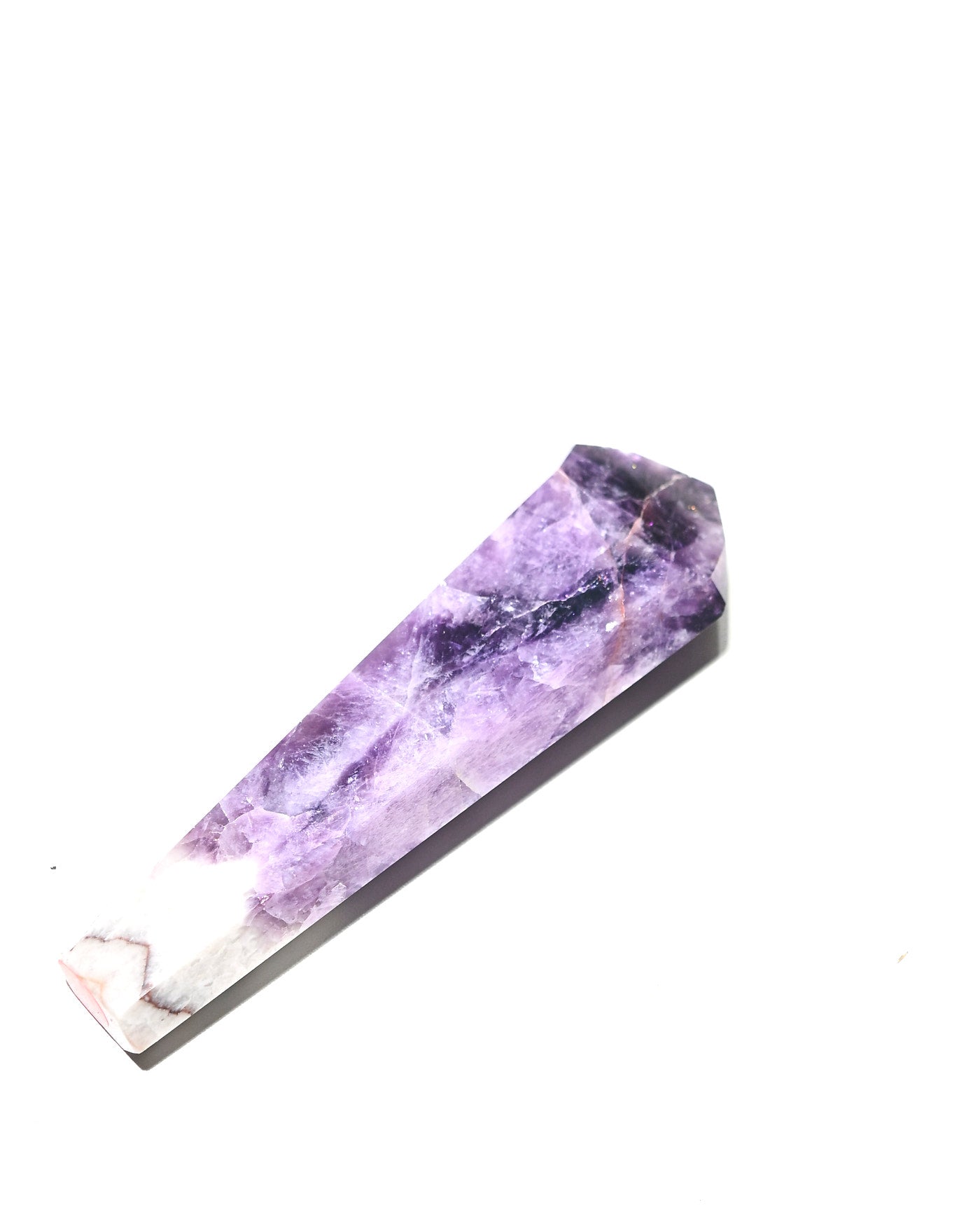 Trapiche amethyst point from Brazil with natural chevron zigzag pattern at base
