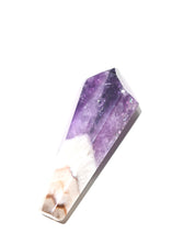 Trapiche amethyst crystal point showing purple to white quartz transition