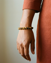 Tiger's Eye Bracelet wrist shot - model wearing golden amber tiger's eye beads