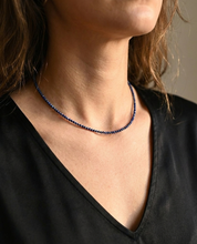 Model wearing lapis lazuli beaded necklace