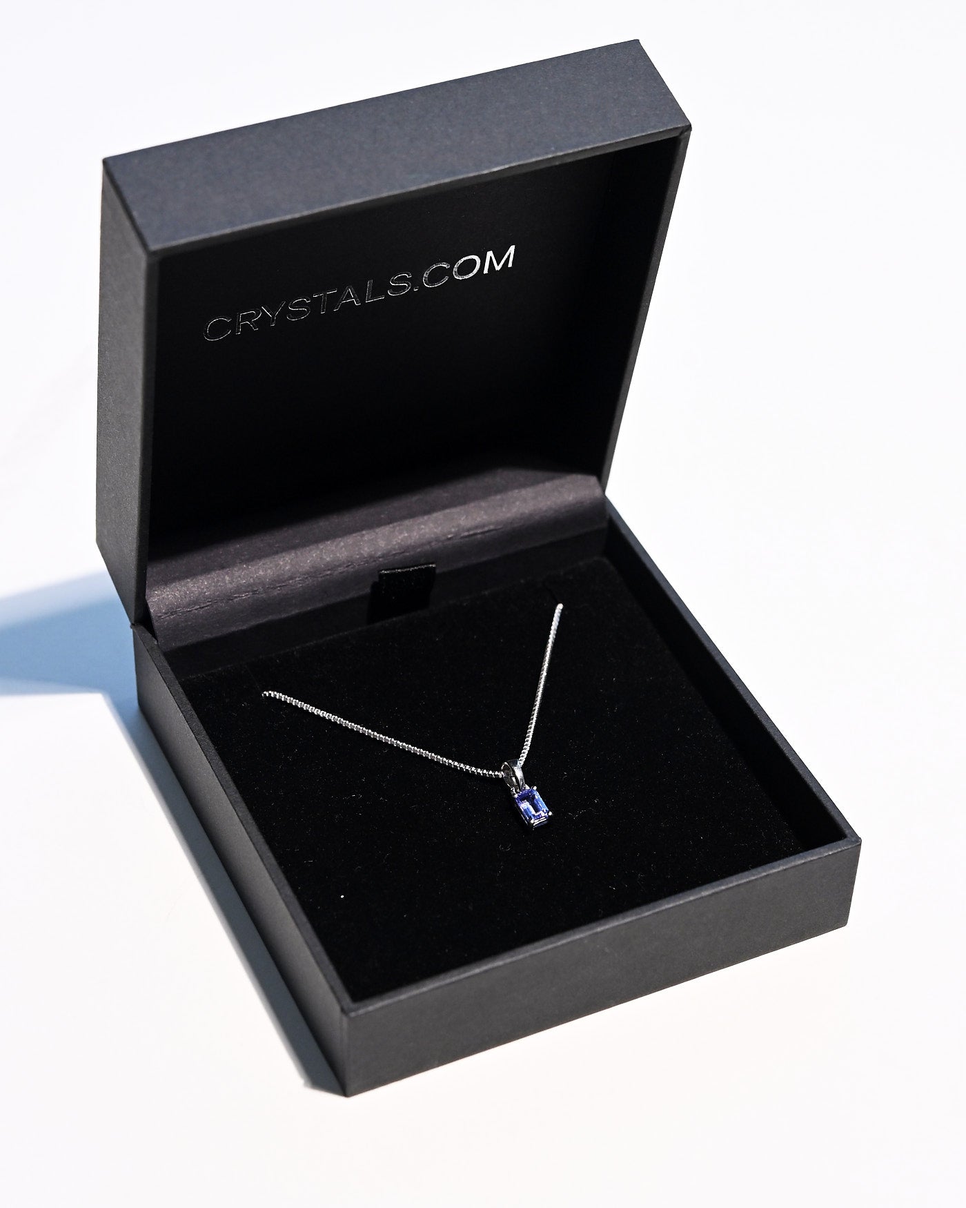 Emerald-cut tanzanite necklace on sterling silver box chain